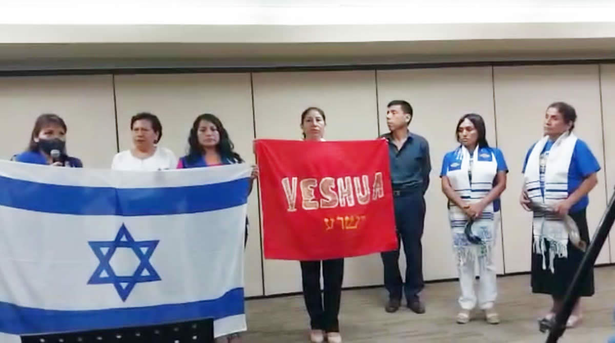 Group of people with Israeli and Yeshua flags