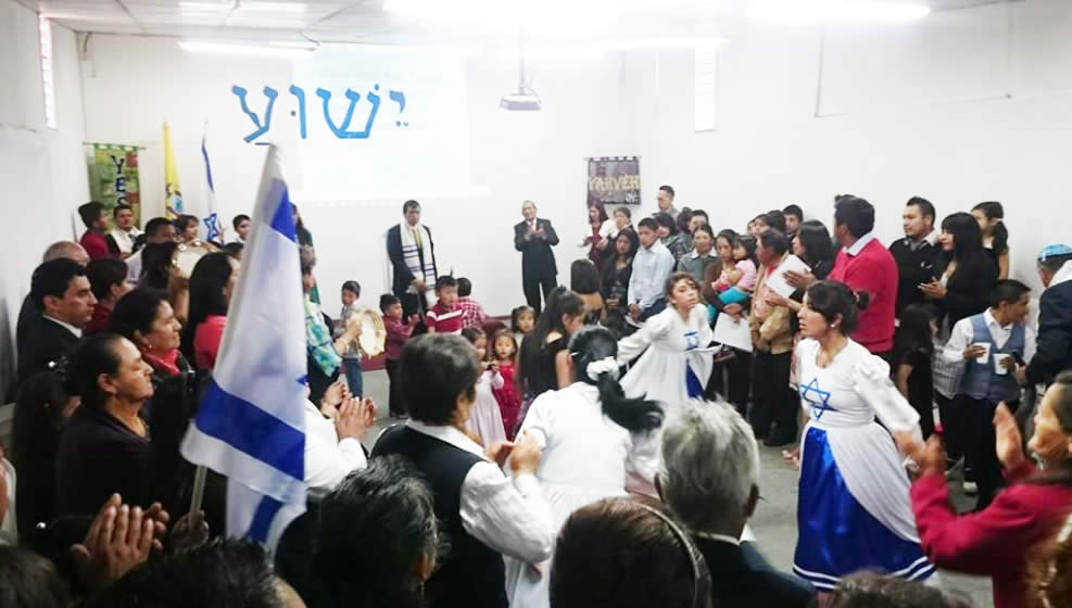 Group of people dancing dressed in Israeli symbols
