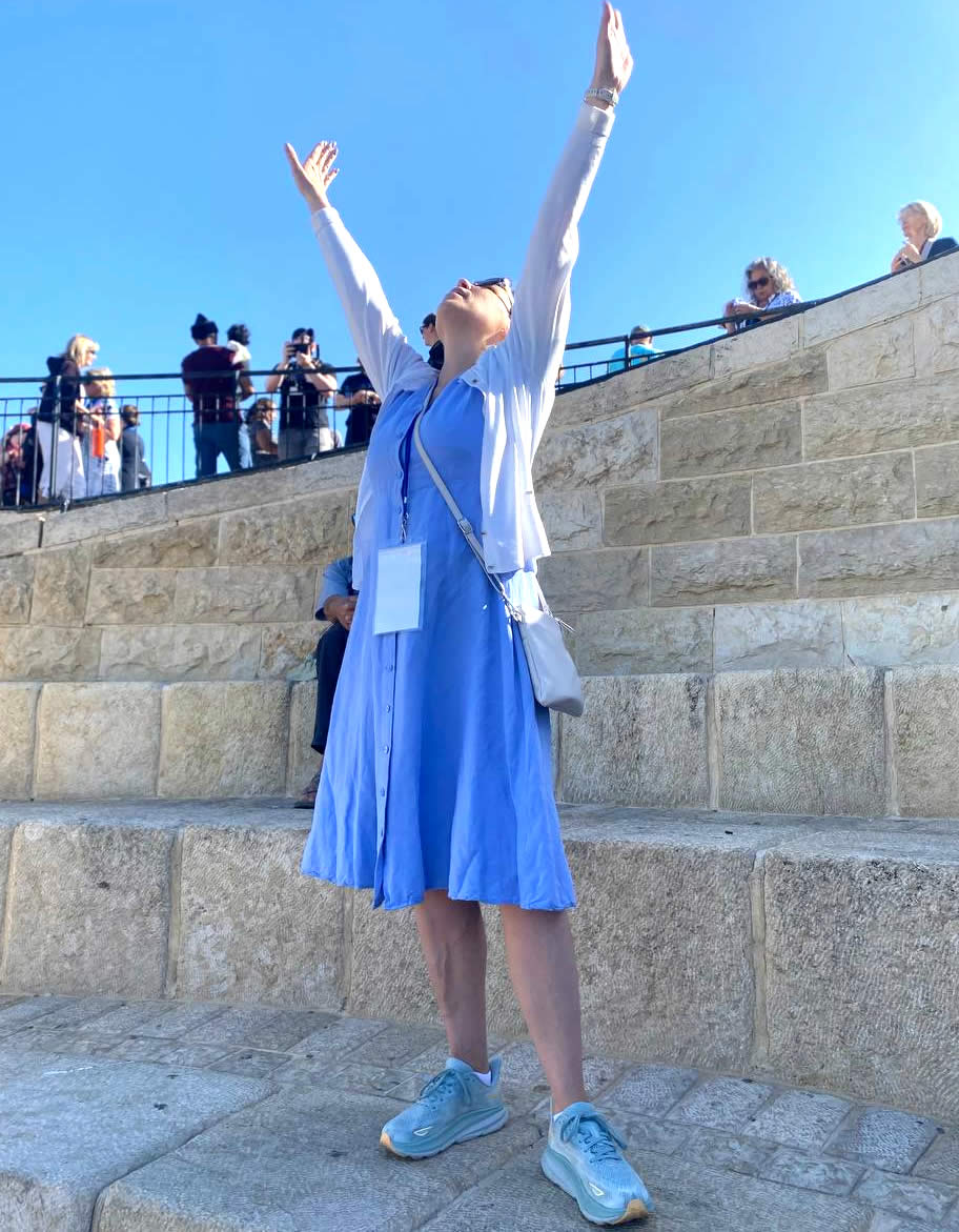 Woman raising hands to the sky