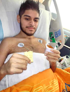 A man lying on hospital bed