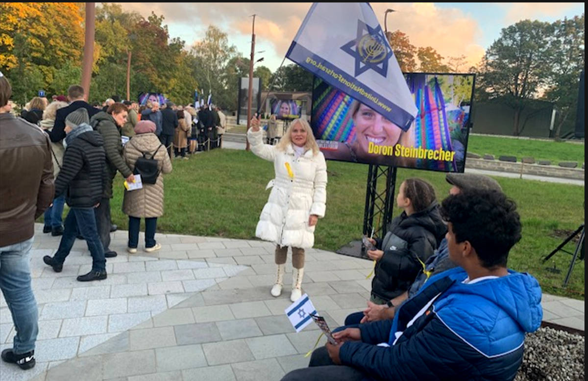 Estonian woman waiving Israeli flag