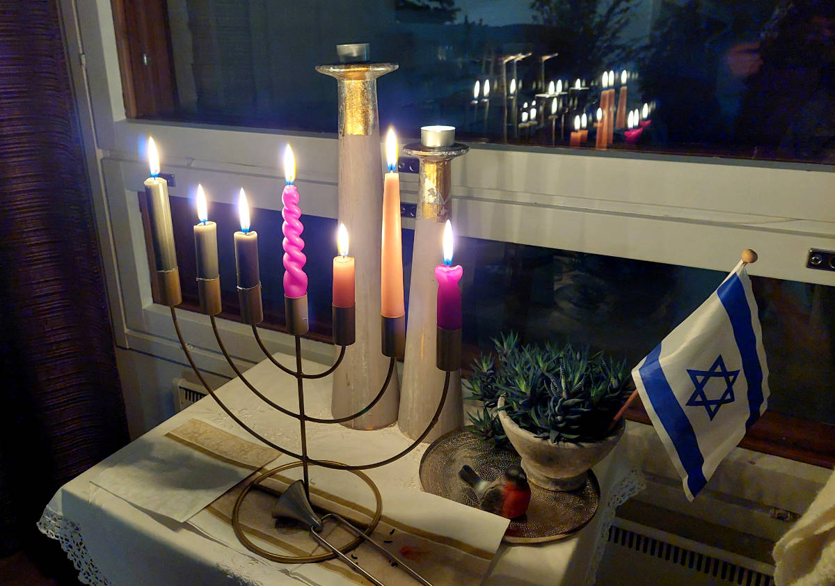 Menorah in front of a window