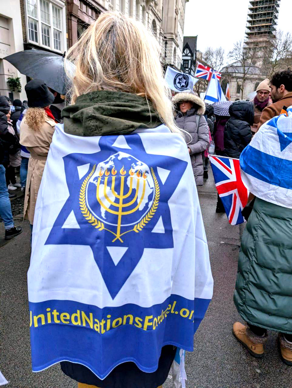 Woman wrapped in UNIFY flag